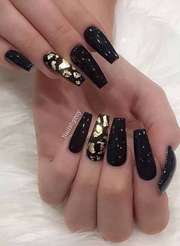 women's black and gold nails