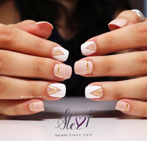 women's white and gold nails
