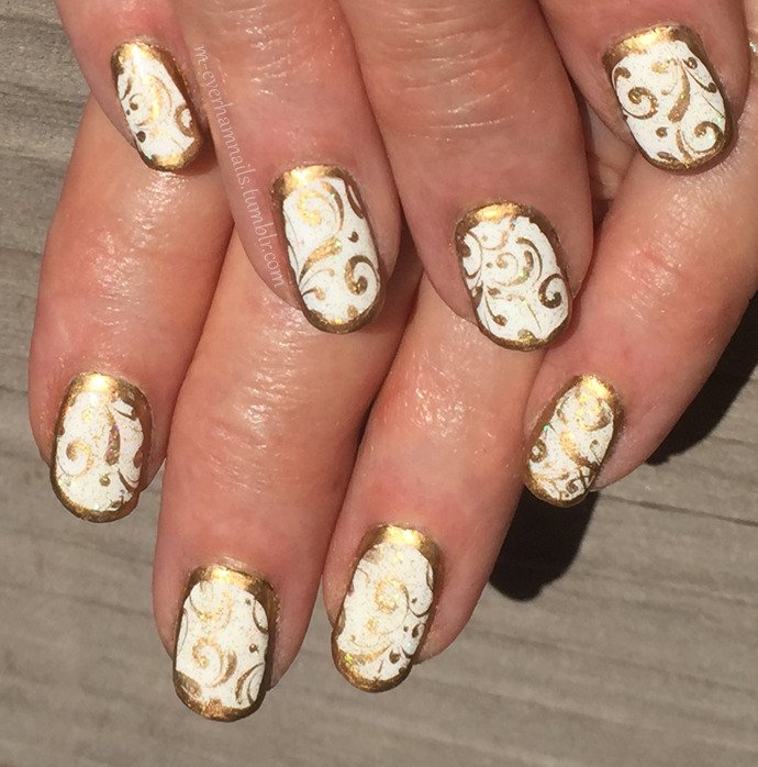 women's white and gold nails