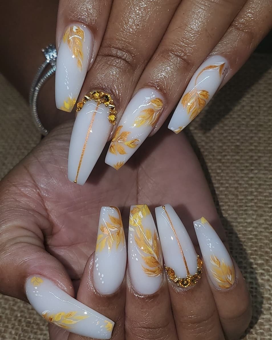 women's white and gold nails