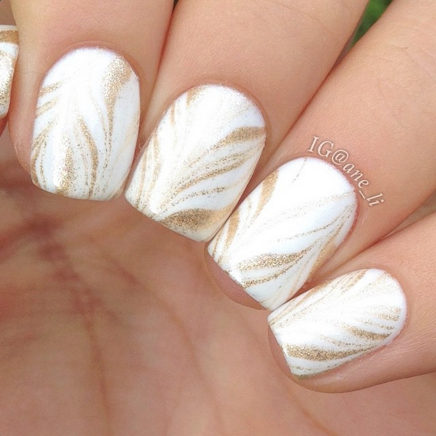 women's white and gold nails